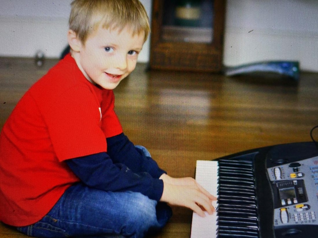 George as a child at a keyboard