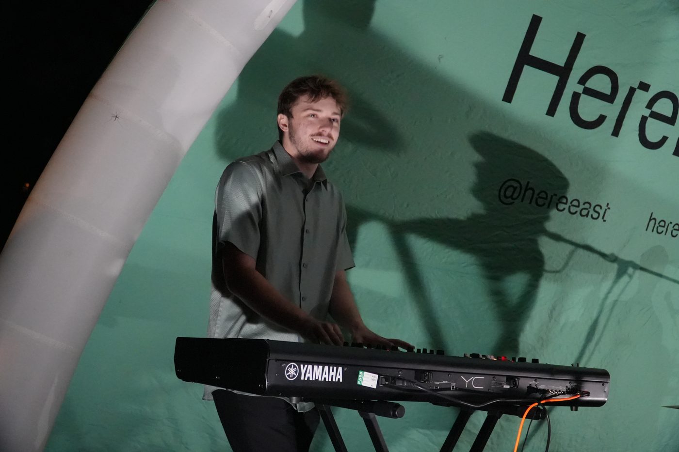George playing keyboard at a live event